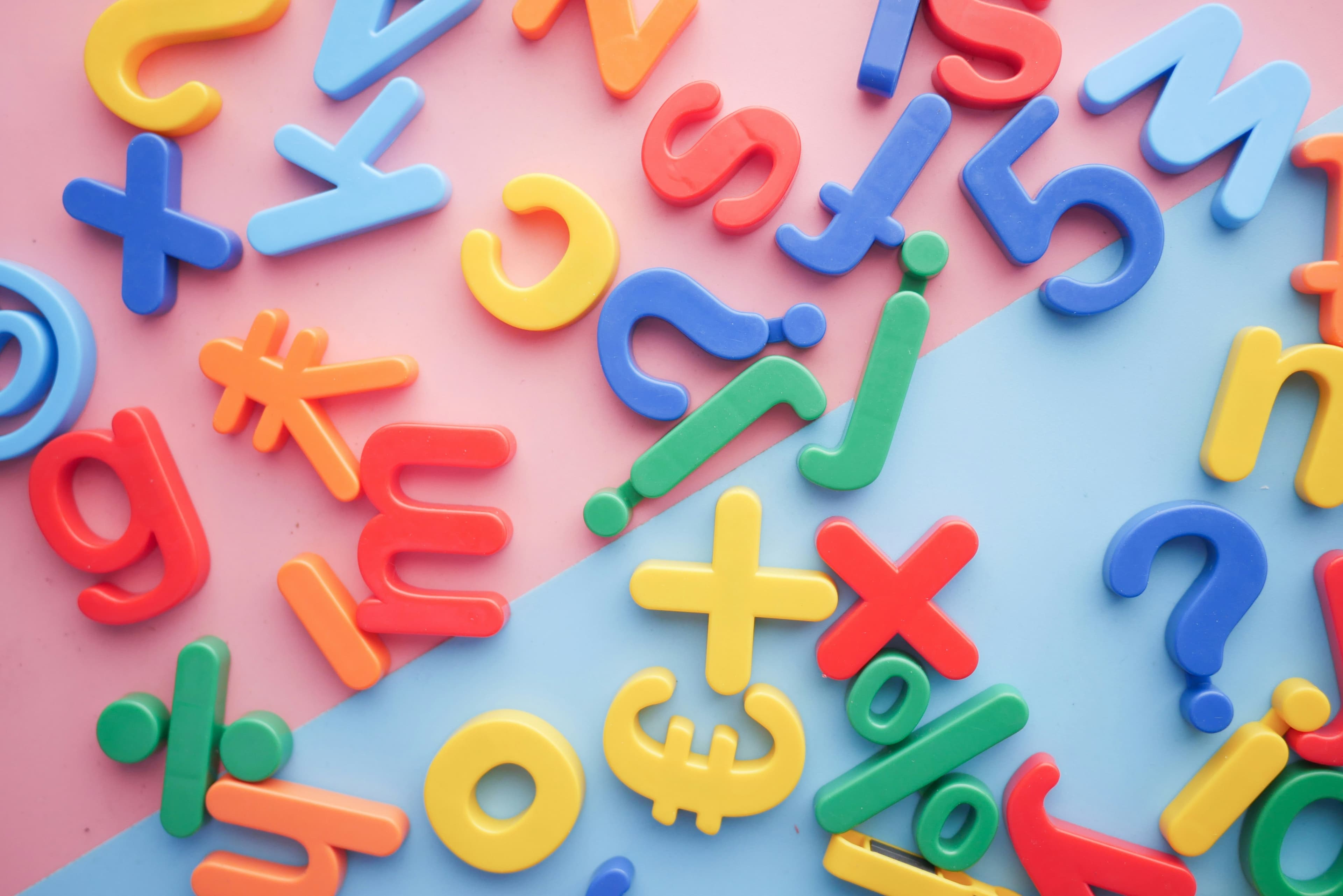 Kids magnetic colourful letters on a colourful background